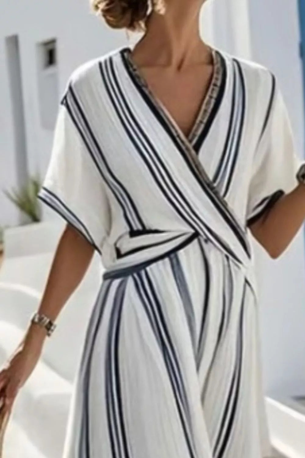 Chic striped wrap maxi dress in white with dark navy stripes, V-neck, short sleeves.