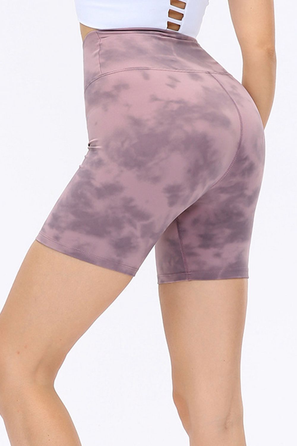 Mauve tie-dye bike shorts with a high waist and sculpted fit.