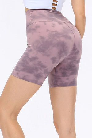 Mauve tie-dye bike shorts with a high waist and sculpted fit.