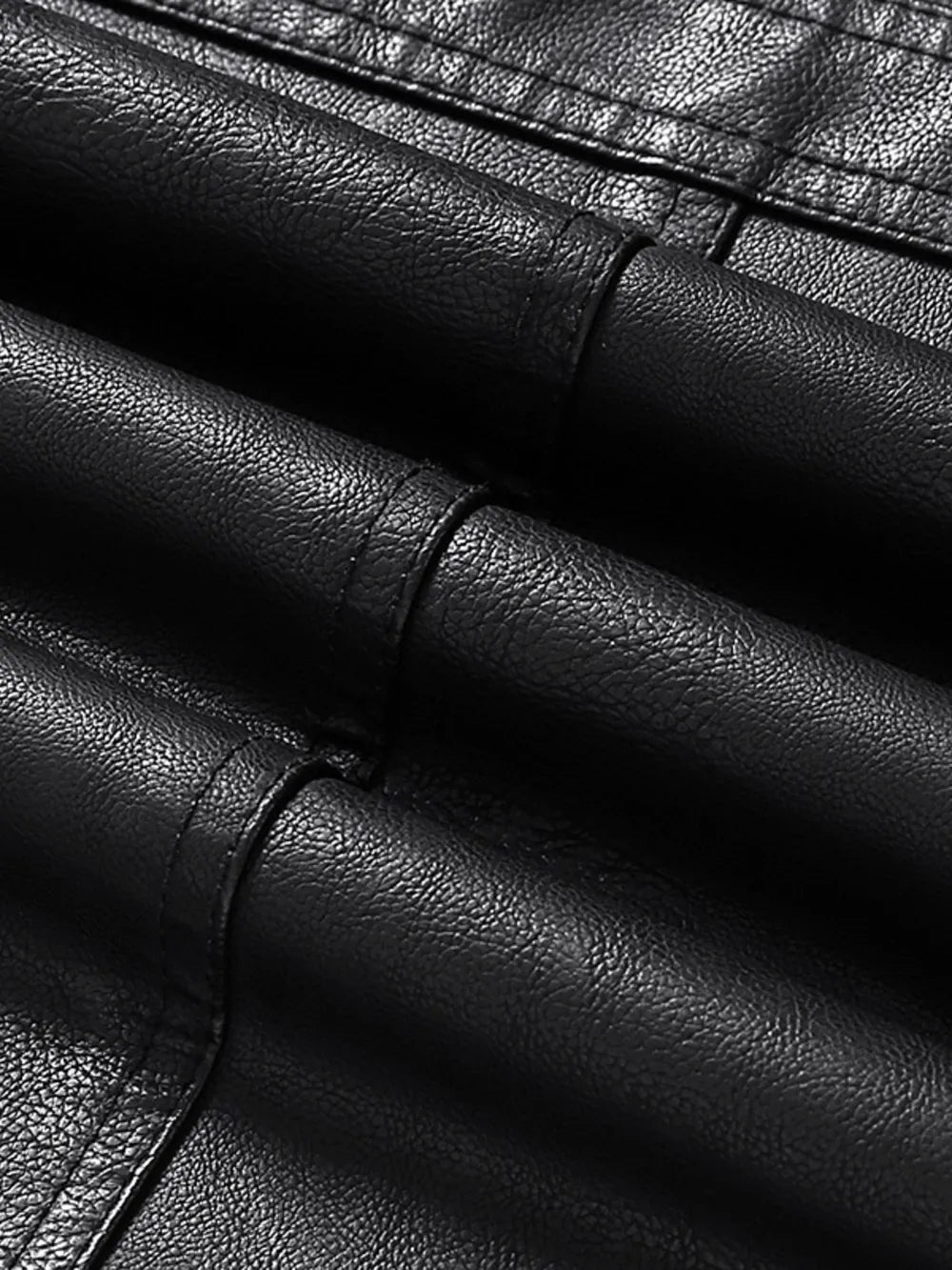 Black faux leather sport jacket detail with textured material and stitching.