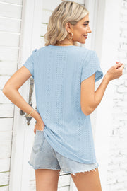Light blue eyelet detail flutter sleeve blouse with a casual fit.