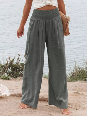 Dark Gray smocked maternity pants with wide legs and pleats.