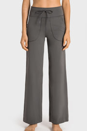 Gray wide-leg lounge joggers with drawstring waist and utility pockets