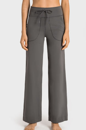 Gray wide-leg lounge joggers with drawstring waist and utility pockets
