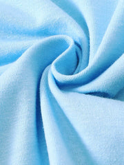 Light blue cotton fabric detail of a baby outfit