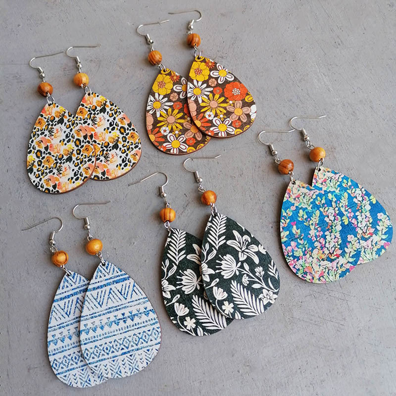 Botanical drop earrings with wood bead in floral and geometric prints.