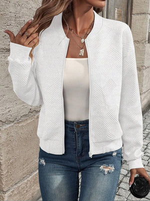 White geometric quilted bomber jacket with zip front and ribbed cuffs.