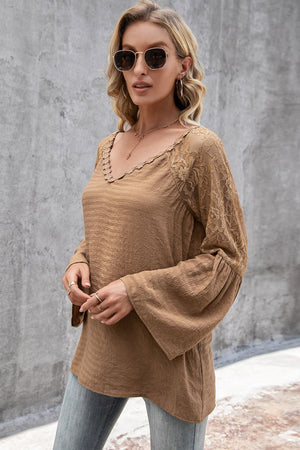 Camel blouse with lace sleeves and scallop trim neckline.
