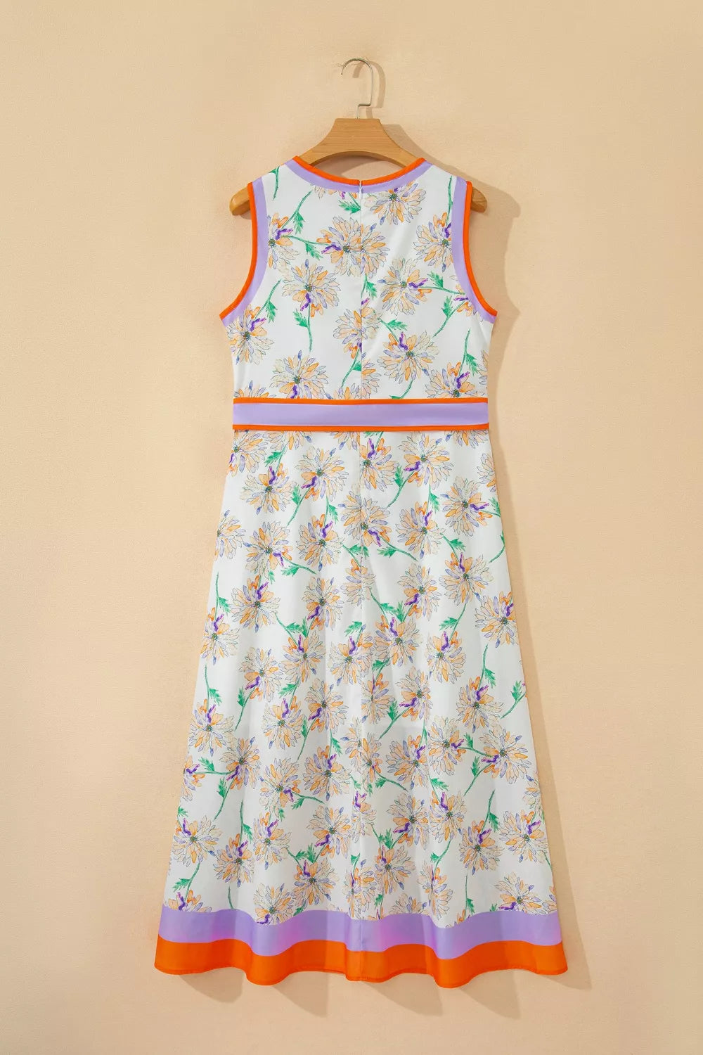 Sleeveless floral print dress with purple and orange trim and a belted waist.