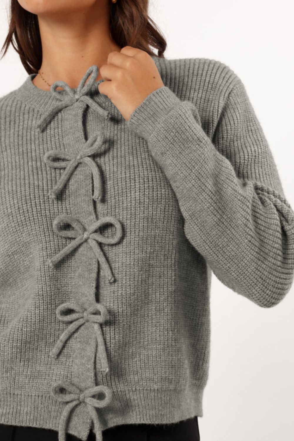 Gray ribbed knit cardigan with tie-front detail and crew neck.