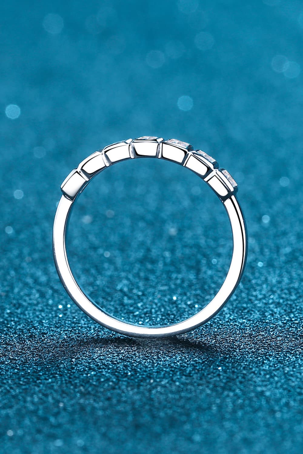 Silver band ring with prism cut diamonds