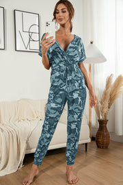Sky blue camouflage print surplice waist jumpsuit with drawstring and short sleeves.