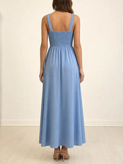 Blue smocked bodice maxi dress with wide straps and A-line skirt.