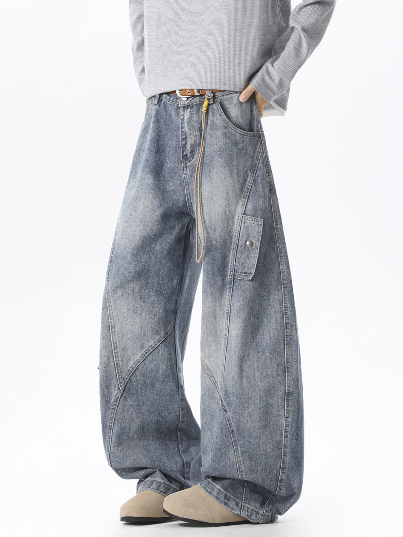 Men's blue wide leg cargo jeans in 100% cotton with a relaxed fit and utility pockets.