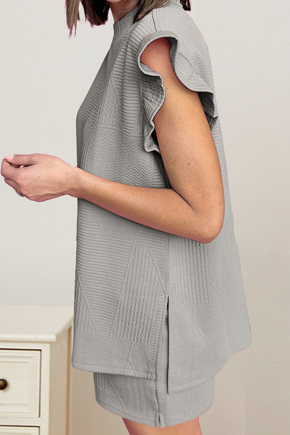 Gray textured lounge set with flutter sleeves and mock neck.