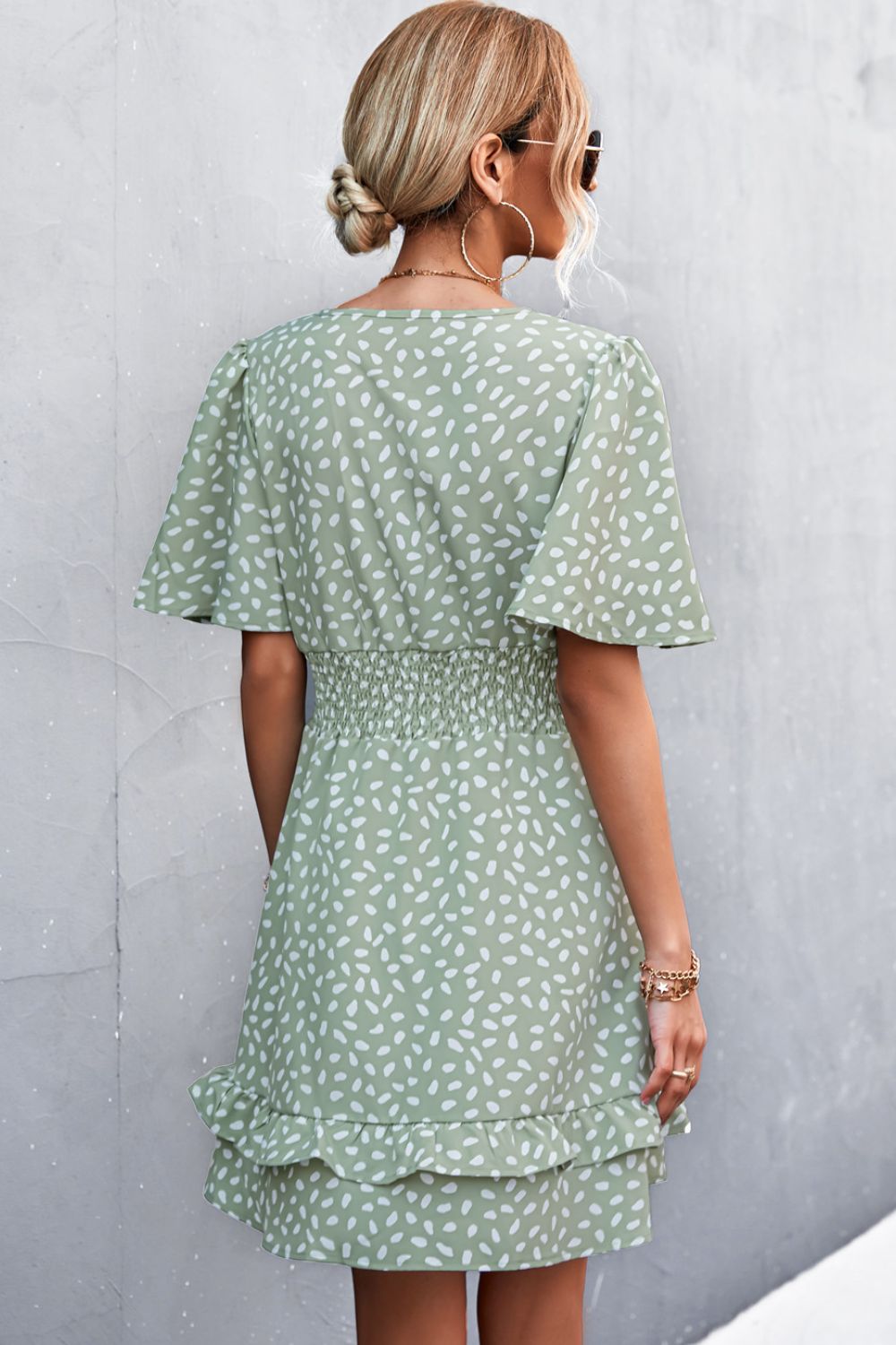 Gum Leaf smocked waist mini dress with flutter sleeves and tiered ruffle hem