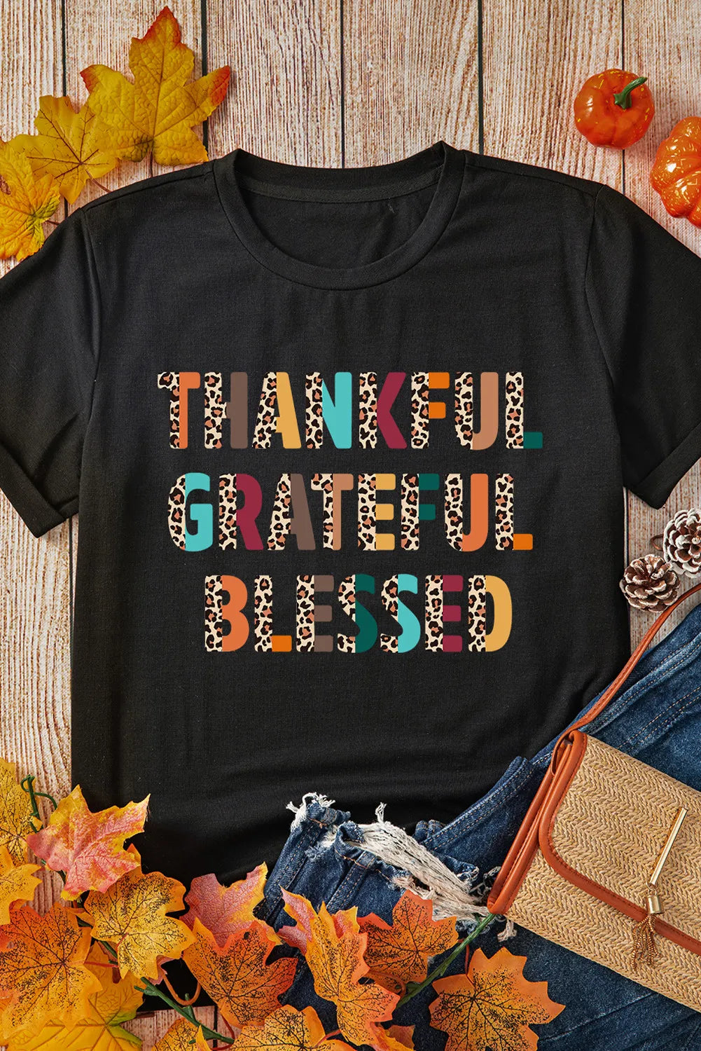 Black graphic tee with leopard print "Thankful Grateful Blessed" text.