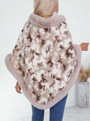 Faux fur trimmed camo poncho in Chocolate with a fuzzy texture and plush trim.