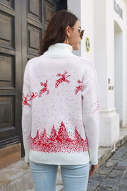 White turtleneck sweater with red reindeer and forest pattern