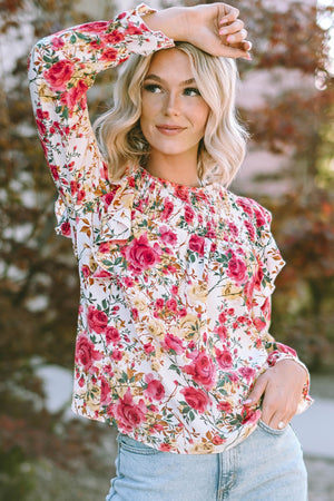 Multicolor floral ruffle smocked yoke blouse with long sleeves.
