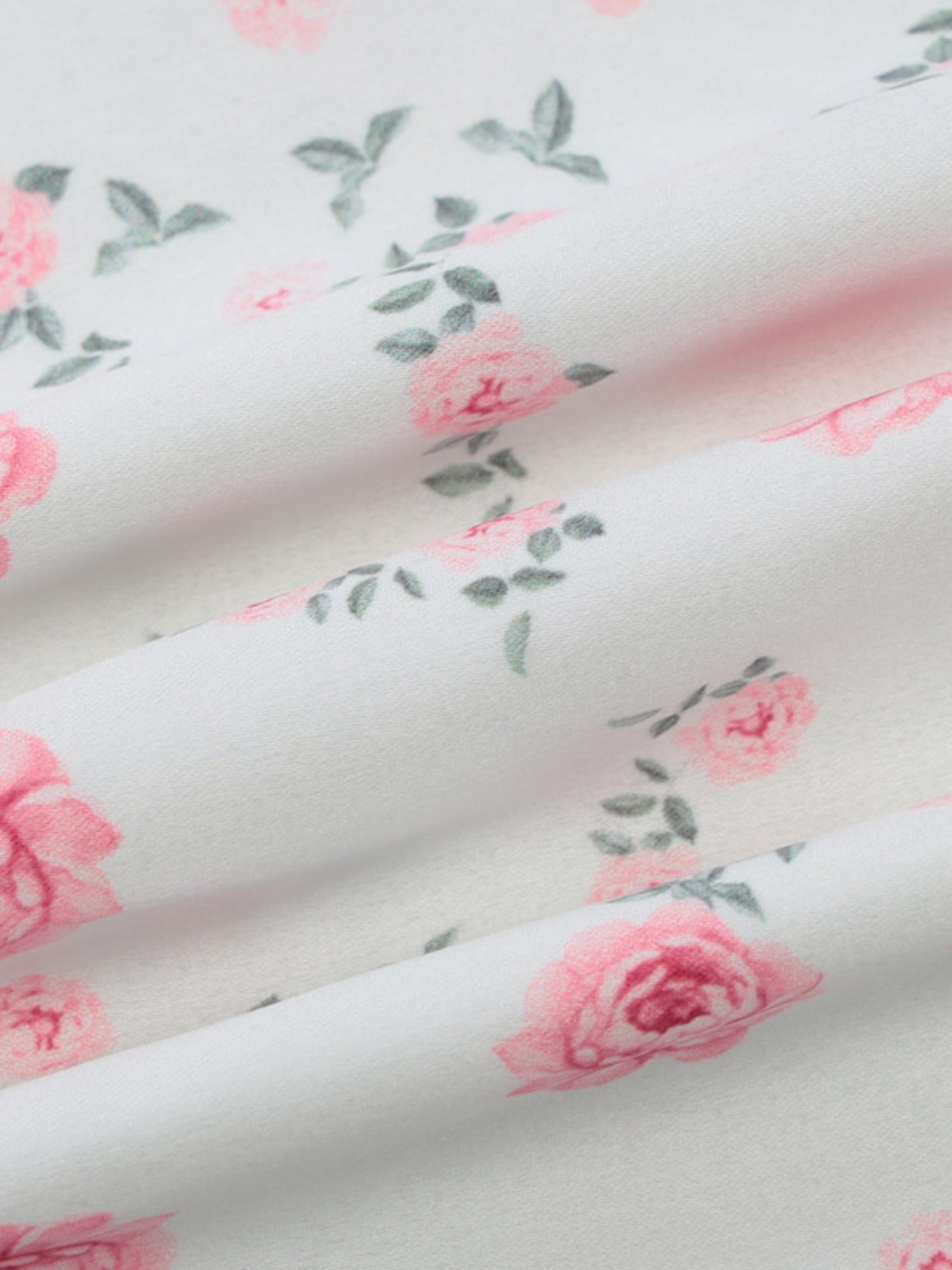 White midi dress fabric with pink rose print and spaghetti straps detail
