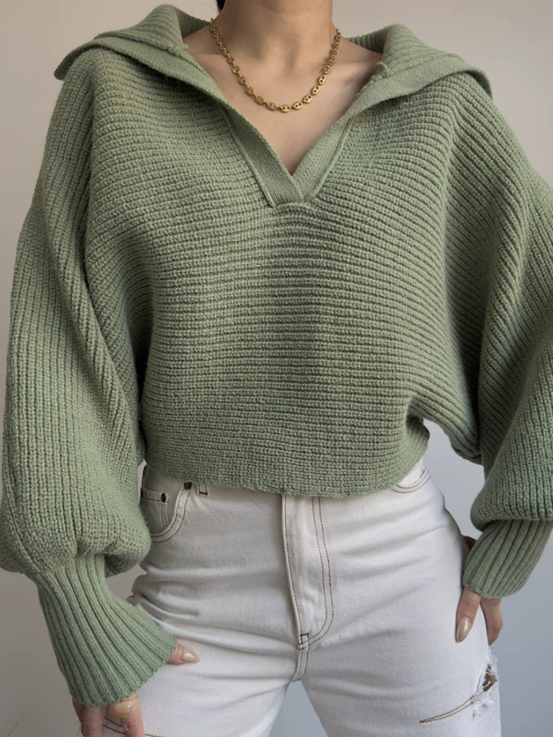 Army green knit sweater with wide collar and balloon sleeves.