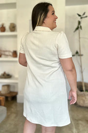 Ivory textured short sleeve mini dress with V-neck and collar
