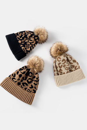 Textured leopard print acrylic beanies with faux fur pom in black and beige.