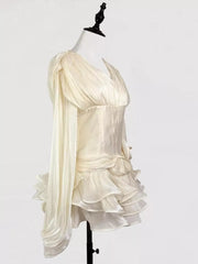 White ruffled mini dress with corset waist and draped sleeves