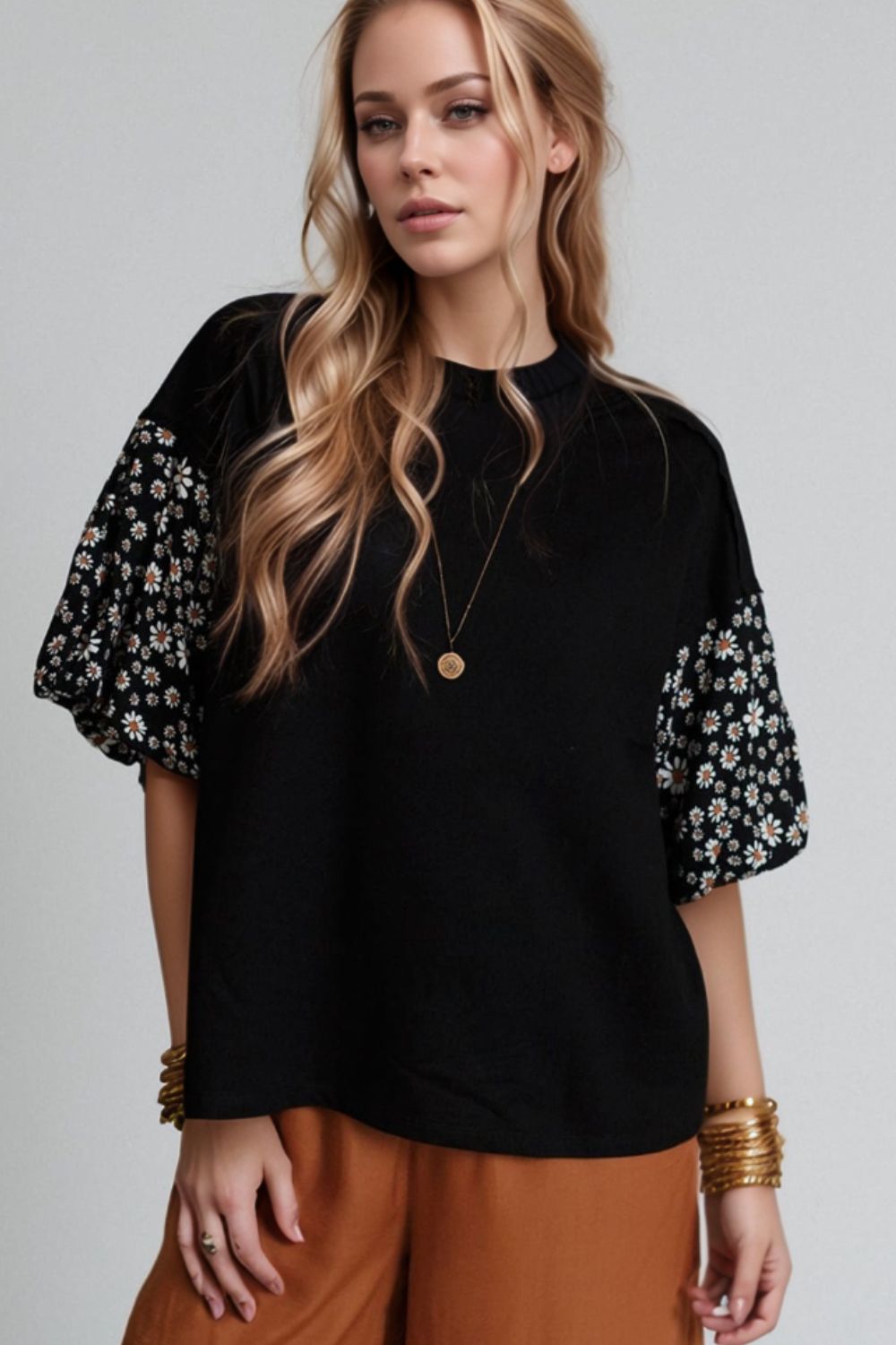 Black t-shirt with contrast daisy print sleeves and crew neck