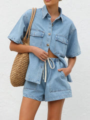 Light wash denim co-ord set with short sleeve button-up shirt and drawstring shorts.
