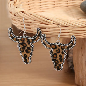 Leopard print bull head drop earrings with silver beaded trim.