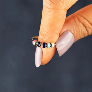 Chromatic Bead Sterling Ring with pink, navy, and aqua beads.