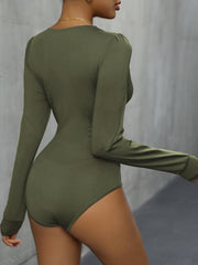Long sleeve bodysuit in Matcha Green with subtle puff shoulders and a high-cut leg.