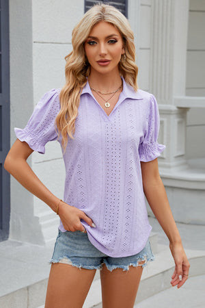 Lavender eyelet polo blouse with short puff sleeves and ruffled cuffs.
