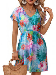 Vibrant leaf print mini dress in sky blue with V-neck and flutter sleeves, cinched waist, and slit detail.
