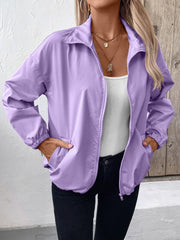 Lavender nylon bomber jacket with zip front, elastic cuffs, and drawstring hem.