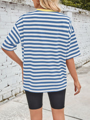 Blue and white striped relaxed tee with contrast yellow neckline and short sleeves.
