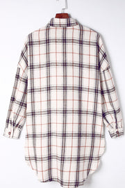 Oversized white plaid shacket with a collared neckline and button cuffs.
