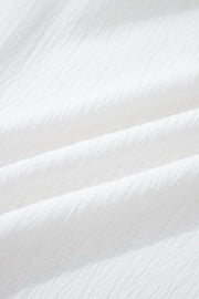 White crinkled texture shirt with elastane, showing fabric detail