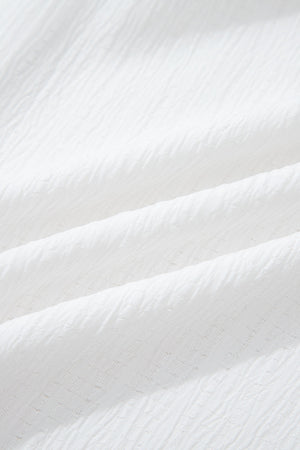 White crinkled texture shirt with elastane, showing fabric detail