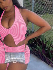 Pink knit halter top with cut-out detail and matching shorts.
