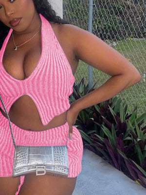 Pink knit halter top with cut-out detail and matching shorts.