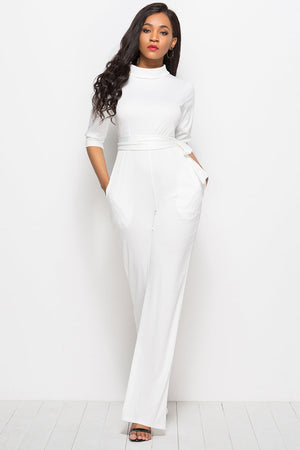 White high-neck belted palazzo jumpsuit with 3/4 sleeves and pockets.
