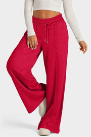 Seamed palazzo lounge trousers in red with drawstring waist and wide leg.