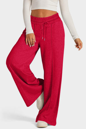 Seamed palazzo lounge trousers in red with drawstring waist and wide leg.