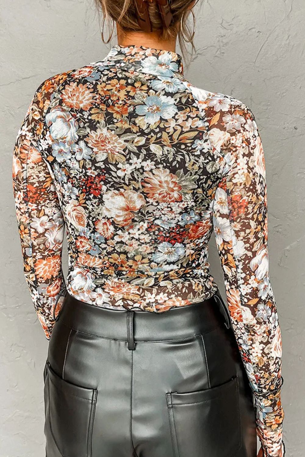 Sheer floral second skin top with long sleeves and a mock neck.