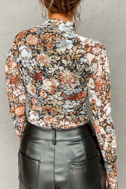 Sheer floral second skin top with long sleeves and a mock neck.