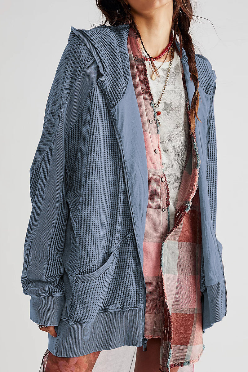 Waffle knit hooded zip-through jacket in blue with contrast panels and pockets.