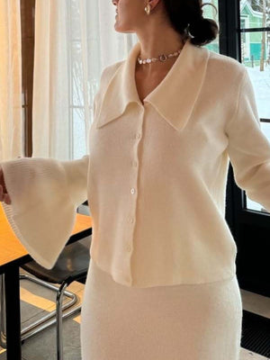 Milky white ribbed knit cardigan with bell sleeves and matching skirt.